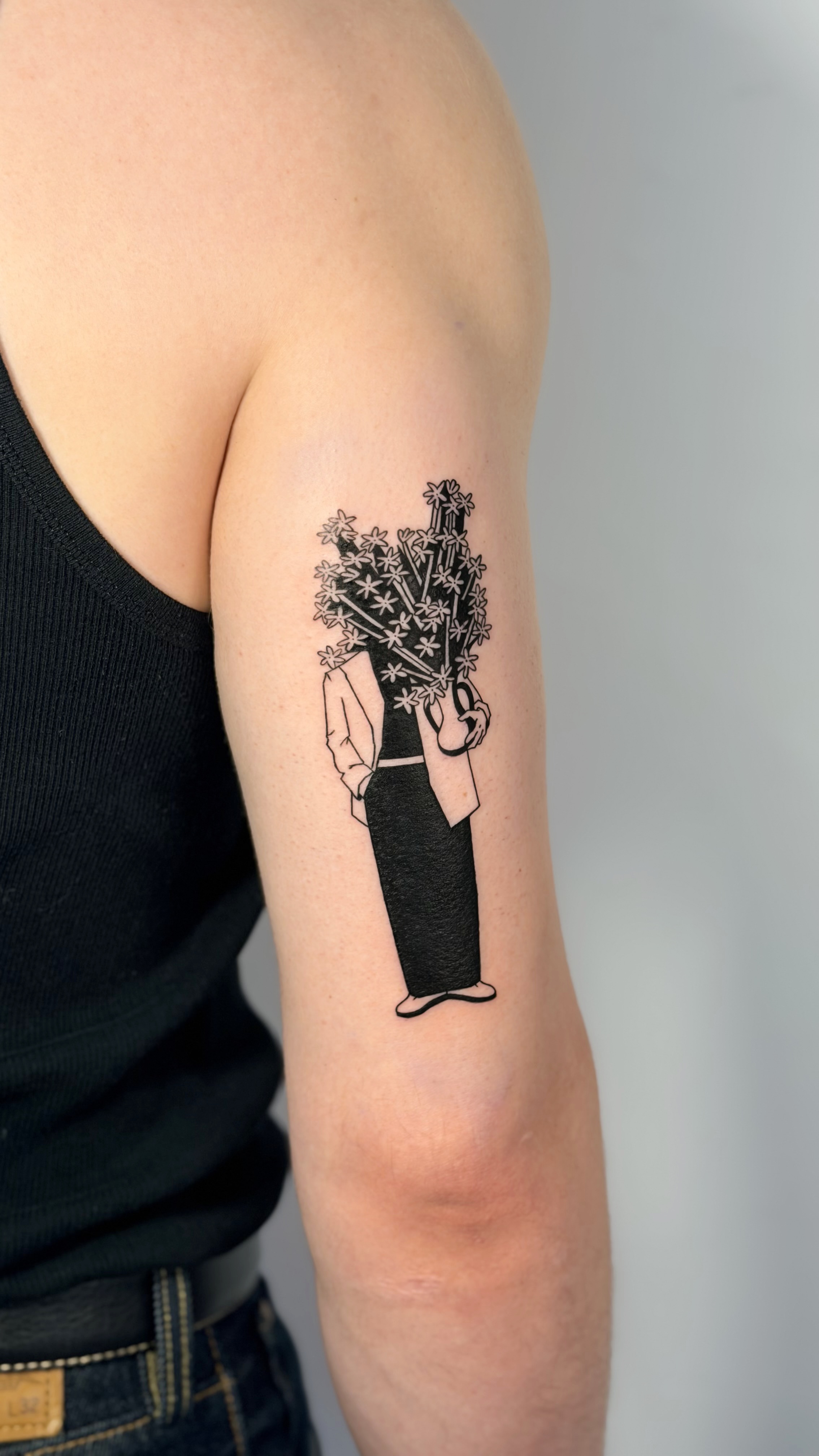 Blackwork forearm tattoo of broken pottery fragments with floral patterns — fine line work and graphic still-life composition by Jane Again Tattoo, Mexico City.